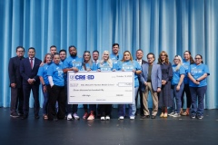 CREEED and SISD leadership recognize teachers from SSG Manuel R. Puentes Middle School with a large check as part of the 3rd Annual AIM High initiative.