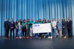 CREEED and SISD leadership recognize teachers from Montwood Middle School with a large check as part of the 3rd Annual AIM High initiative.